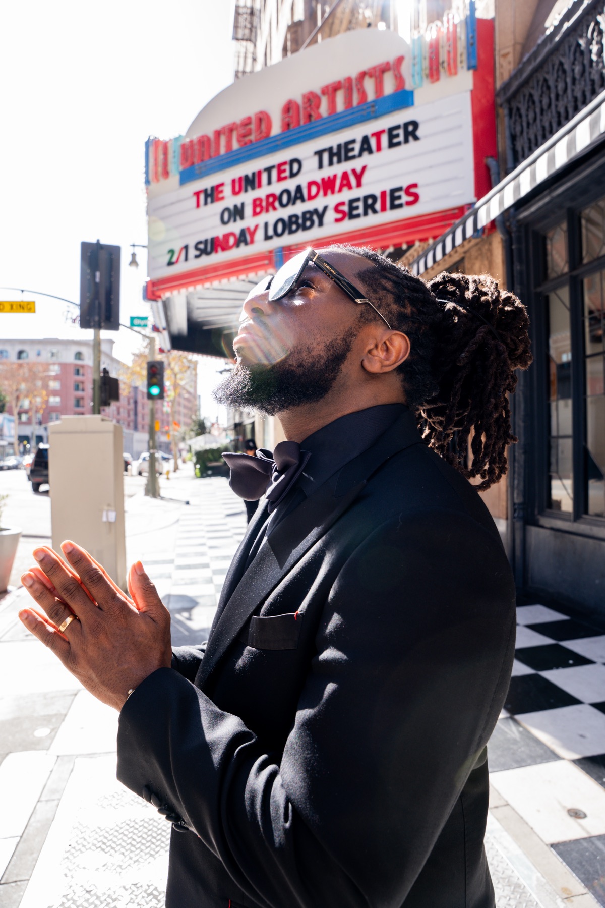 Major Seven in a black tuxedo beneath the United Artists Theater marquee, Grammy weekend in Los Angeles